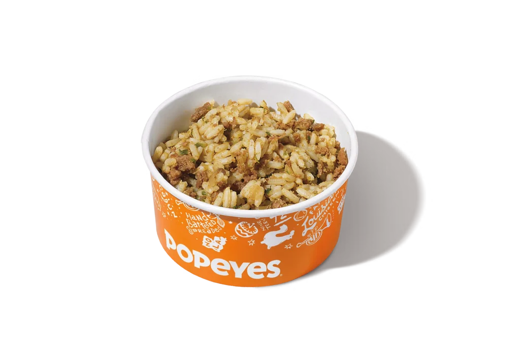 "Popeyes Cajun rice in an orange container."