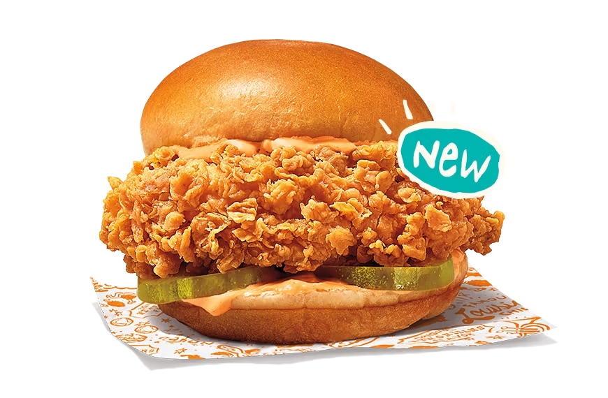 "New Ghost Pepper Chicken Sandwich with crispy chicken, pickles, and spicy sauce on a bun."