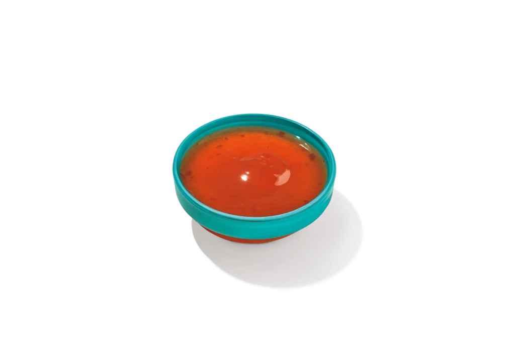 "Bowl of Sweet Heat Sauce on a white background."