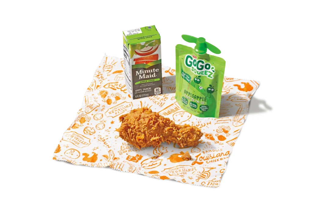 "1-piece leg kid's meal with juice box, apple sauce, and a crispy fried chicken leg."