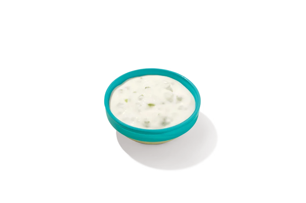 "Bowl of Tartar Sauce on a white background."