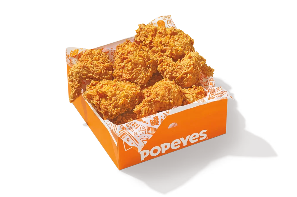 "16Pc Signature Chicken in a Popeyes branded box, featuring crispy golden fried chicken."