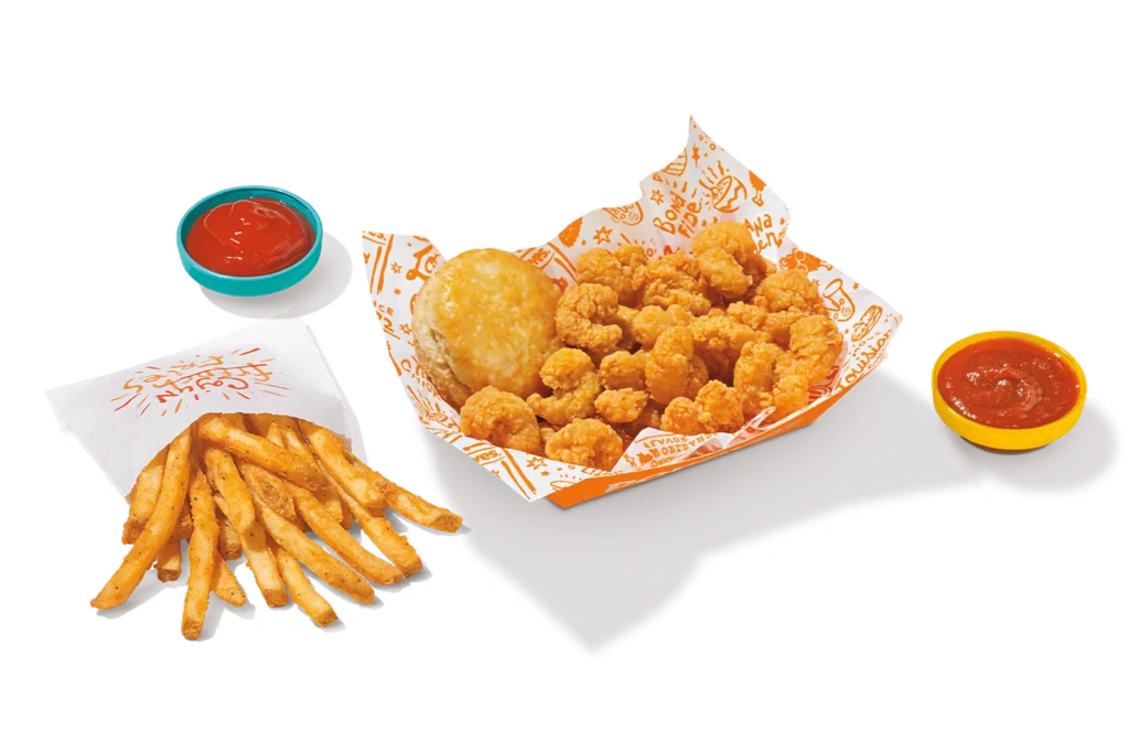 "Quarter pound popcorn shrimp with fries, biscuit, and dipping sauces on the side."