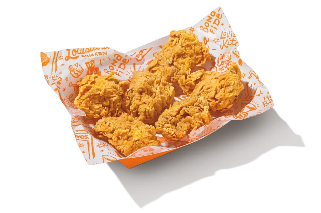 "Classic Boneless Wings served in branded packaging with crispy, golden-brown coating."