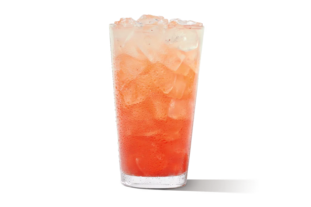 "Glass of premium strawberry lemonade with ice."
