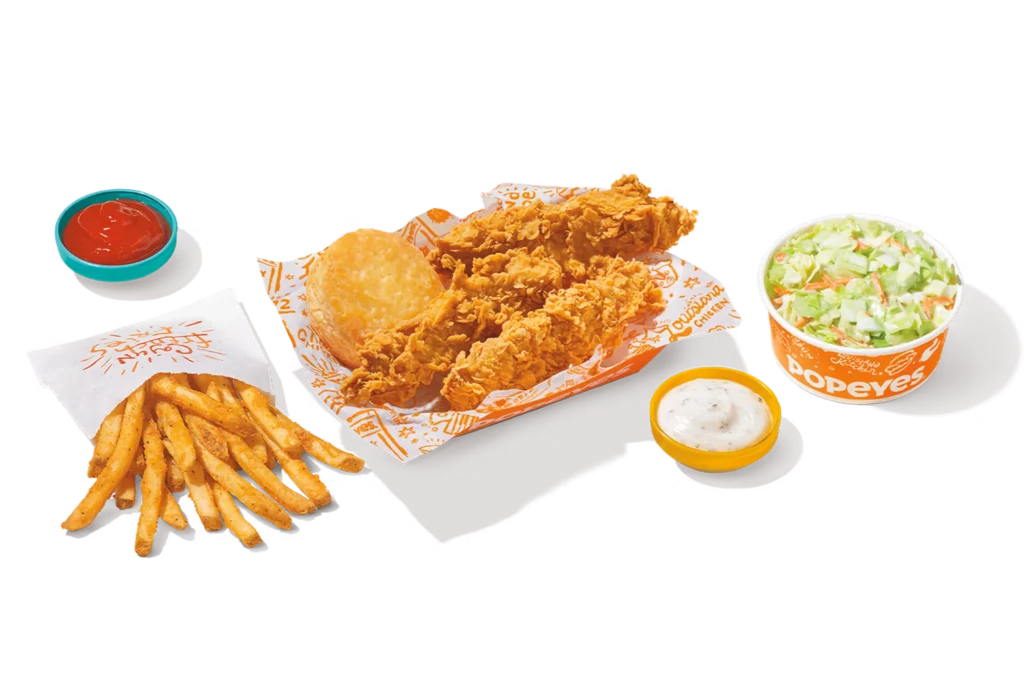 "Popeyes 3Pc Tenders with fries, dipping sauces, and a Coca-Cola drink."