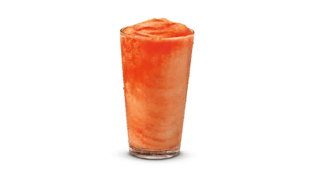 "Glass of Hurricane Lemonade Frozen with a bright orange-red slushy texture, on a white background."