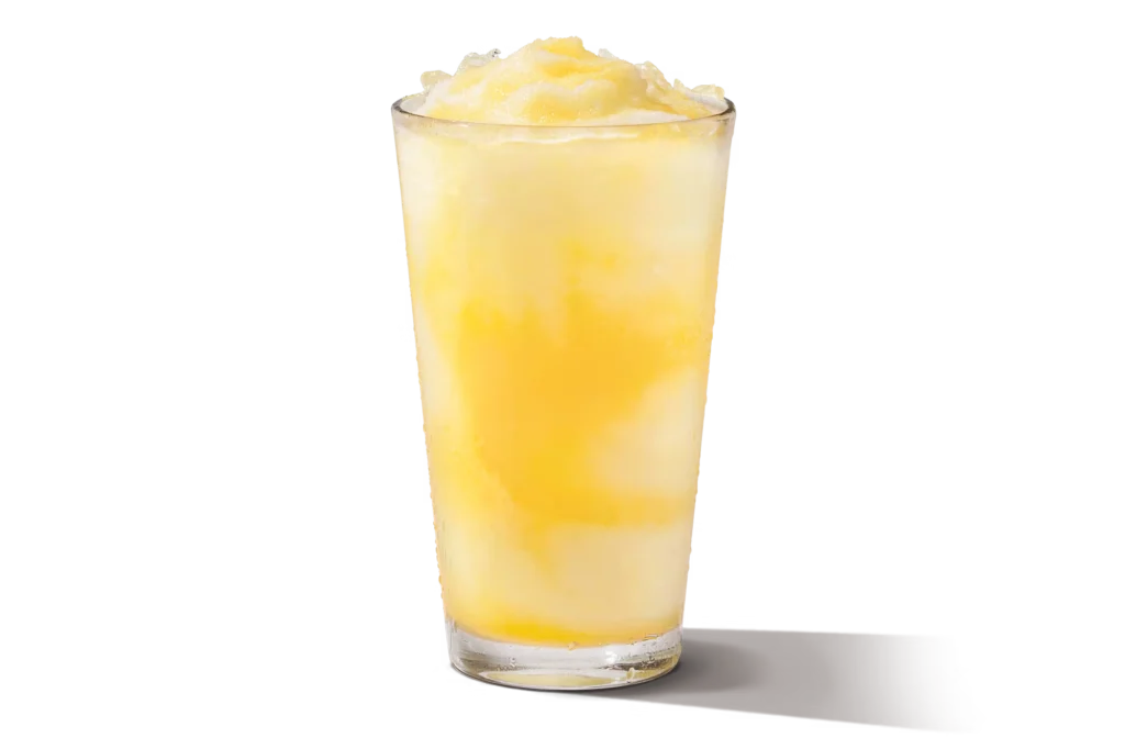 "Glass of frozen pineapple lemonade."