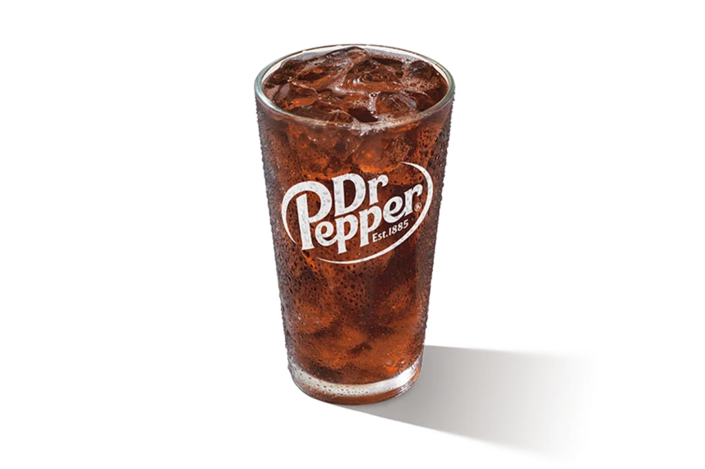 "Glass of Diet Dr Pepper with ice cubes, Dr Pepper logo on the glass, on a white background."