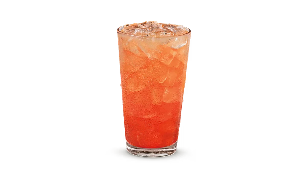 "Glass of Hurricane Lemonade Frozen, with a vibrant orange-red slushy texture, on a white background."